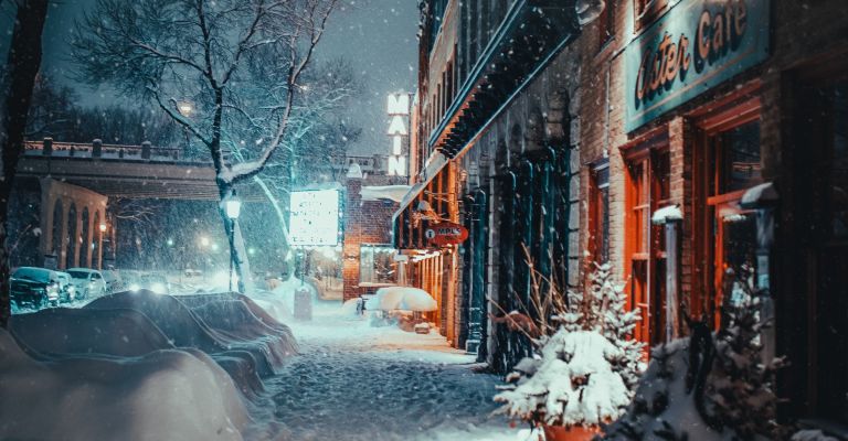 snowy main street at night from ground level