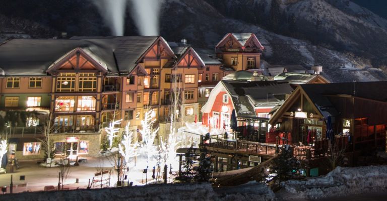 view of shops and mountain in the background